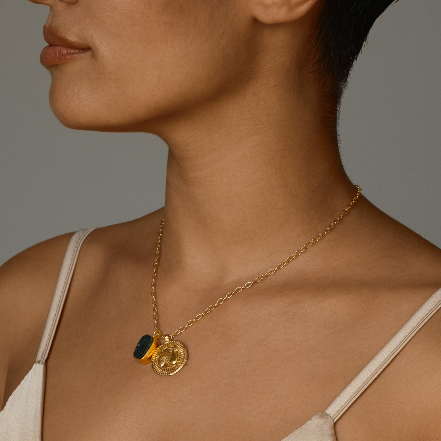 Gold Capricorn zodiac charm necklace with Moss Agate elemental crystal. Earth sign jewelry for grounding, growth & abundance.