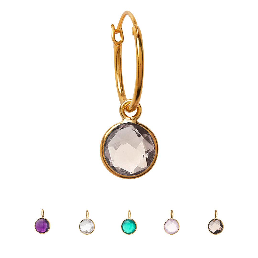 A selection of a single round crystal gemstone power stone hanging from a gold vermeil over sterling silver hoop earring. They are available in different gemstones: clear quartz, smoky quartz, rose quartz, amethyst & green onyx.
