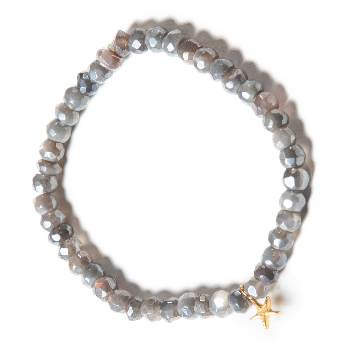Handmade moonstone bead bracelet in smoke grey and subtle pink hues, with a delicate gold star charm. This sacred moonstone jewelry is a talisman for travelers, a stone of prophecy, and a symbol of true love, connecting wearers to the night sky's expansive energy.