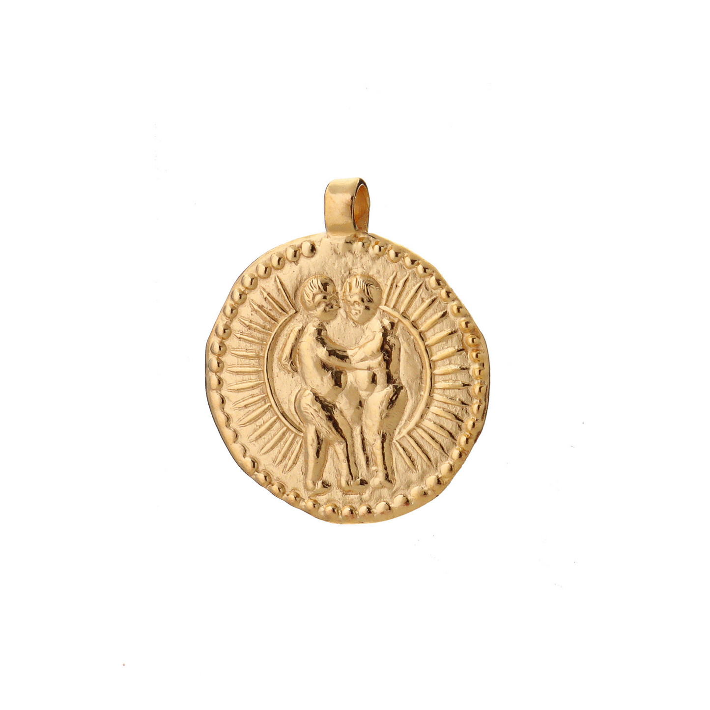 A golden talisman made from an ancient coin depicting two twins, Gemini, embracing infront of a full sun.