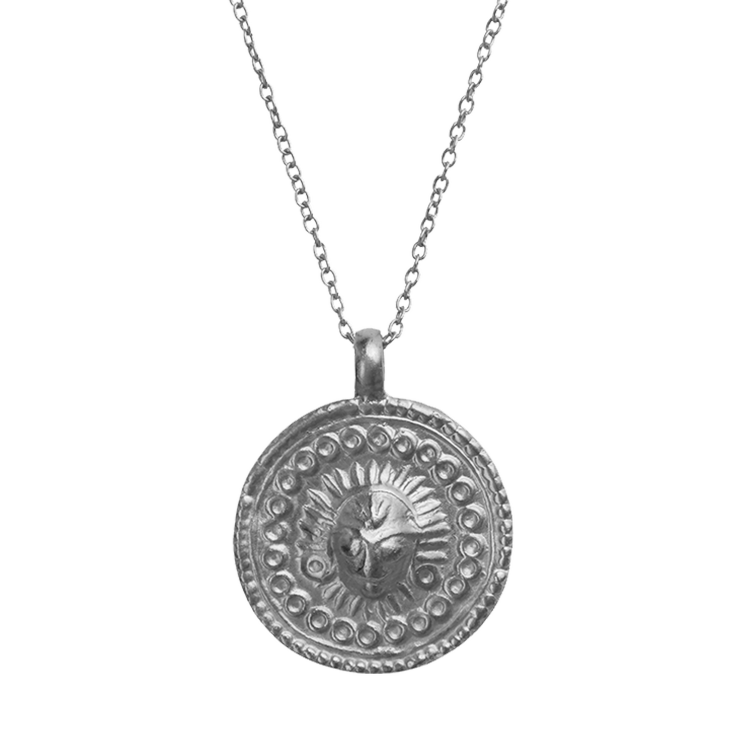 A coin pendant Charm from India depicting the Sun, also know as Lord Surya.